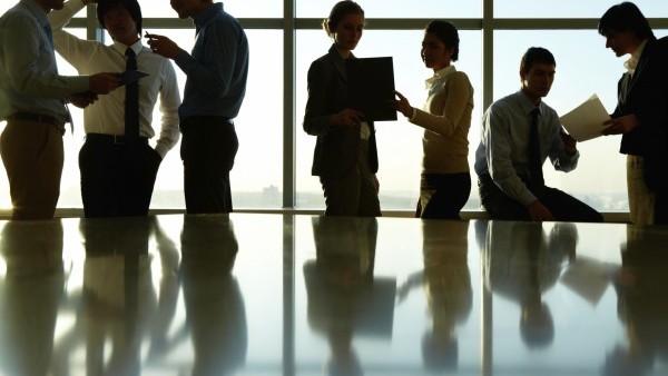 Corporate workers around table